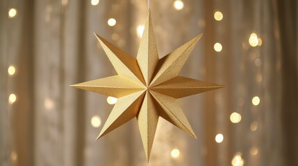 Canvas Print - gold paper star ornament hanging against a bokeh background of fairy lights.