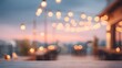 © Blur Bokeh - Open-air rooftop restaurant with fairy lights, scenic views, and busy atmosphere. blurred image, soft out-of-focus background