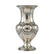 © Susanw - A detailed photo of an antique silver vase with intricate designs. It is a vintage silver vase