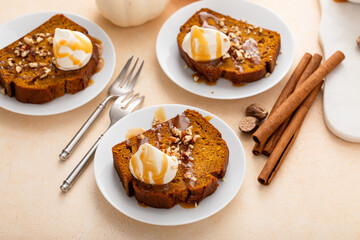 Wall Mural - Pumpkin bread freshly baked and sliced on a serving board