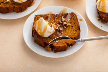 Wall Mural - Pumpkin bread freshly baked and sliced on a serving board