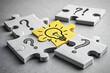 © Designer - Idea and Solution Puzzle Concept | Light Bulb Piece Among Question Marks