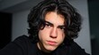 © MST - Portrait of a Young Man with Long Dark Hair and Brown Eyes