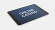 © Cliff - Tablet isolated on white background, the inscription 'ONLINE CASINO' on the smartphone screen, minimalism. High quality, 3D rendering. Concept of gambling addiction, online fraud, fake casino, jackpot