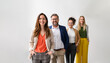 © Moon Safari - Portrait of successful professional leaders standing in a row and posing together on white background