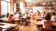 © Johannes - A Blurry or out - of - focus image of elementary school classroom with students sitting and studying, abstract design for background.