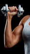 © OleksandrZastrozhnov - Young caucasian female lifting dumbbell with strong arm in white tank top
