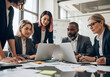 ©  marufur rashid - A group of diverse business people are working together in a corporate meeting, fostering teamwork and discussion in the office