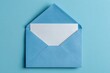 © Nanda - Light blue envelope with a blank card on a matching blue background. Use this for invitations, letters, mail, or business communications.