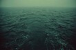 © YOGA - Vast, dark, moody ocean surface