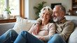 © MinaNasrin - Loving Older Couple Relaxing Together on Comfortable Sofa in Bright Living Room