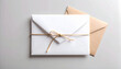 © ArceusDigital - Correspondence Package: An inviting composition features a stack of crisp, blank envelopes, artfully tied with natural twine, next to a single kraft envelope.