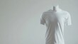 © Nahwu - A simple, clean image shows a headless mannequin wearing a plain white, short-sleeved t-shirt against a light grey background.  The focus is on the garment's texture and fit