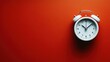 © TITISCAHYA - Simple alarm clock on vibrant red background