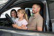 © New Africa - Happy family sitting inside new car. Luxury vehicle