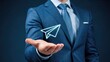 © Furqan - Modern businessman offering digital paper plane innovation communication solution opportunity help