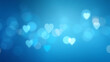 © mraual24 - A serene blue background is adorned with soft bokeh lights in the shape of hearts evoking a feeling of love and romance