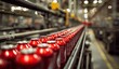 © Visual Symphony - Red cans moving on production line in factory