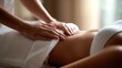 © ปฏิภาน ผดุงรัตน์ - A person receiving a relaxing massage treatment with hands in focus. The scene conveys a sense of serenity and rejuvenation