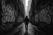 © MdShahajan - Lone figure walks down a dark graffiti covered alleyway with towering city buildings in the distance