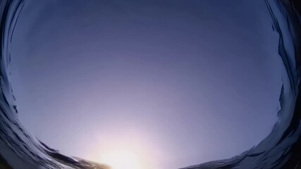 Wall Mural - stunning underwater 4K vertical video capturing golden sunset rays beaming through surface ripples viewed from beneath water conveying peace reflection tranquil rhythm natural