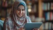 © Randu - Enchanting muslim woman immersed in digital world, connecting with a tablet