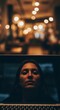 © zabhie - Woman's reflection on laptop screen with warm bokeh lights, symbolizing focus or introspection