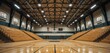 © Pungkas - Interior wide view of an empty high school gymnasium with wooden bleachers and polished basketball
