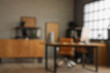 © Pixel-Shot - Blurred view of modern office with workplace