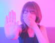 © noonekoon - Young Woman Covering Nose in Club Setting クラブで鼻を覆う若い女性