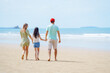 © DJ Creative Studio - Beach Family Vacation in Summer, Happy Parents Holding Hands with Daughter Walking Together on Sandy Shoreline in Relaxing Outdoor Holiday Moment