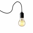 © Md Saiful - Glowing filament bulb hanging from black cord lightbulb warm