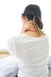 © Ton Photographer4289 - Young woman holding her neck with her hand due to severe neck pain from tendon spasm, muscle aches, Medical and healthcare concept