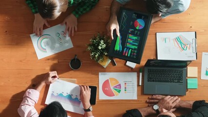 Wall Mural - top view of diverse business people working together to analyze chart. top down aerial view of creat