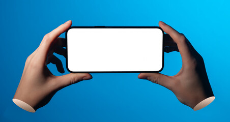 Phone mockup held sideways between hands. Empty screen ready for content. Clean blue background