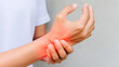 © Taras Vykhopen - Painful wrist joint with visible redness and swelling in a medical illustration style