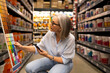 © Ivan Traimak - Engaging woman in a modern warehouse selecting paint colors for home improvement projects