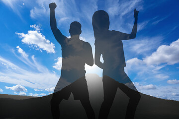 Wall Mural - hope. silhouettes of man and woman on top of mountain, double exposure