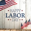 © Limon - Happy labor day message with american flags on a rustic white wooden background