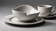© Nathan - Elegant white ceramic tableware set featuring a bowl and cup, showcasing a modern design and smooth texture.