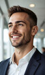 © panophotograph - White male professional with a gentle smile, looking slightly to the side, showcasing curiosity and understanding of future challenges