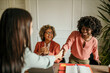 © La Famiglia - Businesswomen shaking hands after successful job interview