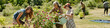 © pressmaster - Multiethnic group of middle aged woman, teenager girl, young adult woman and young adult man gardening together outdoors, planting and watering flowers in green park setting