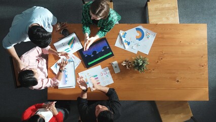 Wall Mural - top down view of business woman explain and present financial chart. group discuss and listen presen