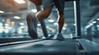 © songpol152 - A person running on a treadmill in a modern gym, with blurred background emphasizing motion and fitness.