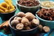 © New Africa - Different aromatic spices on blue tablecloth, closeup