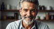© Rakibul - Smiling mature man with salt and pepper beard and hair