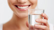 © PixelCharm - Close-Up of Smiling Woman Holding a Glass of Fresh Drinking Water