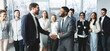 © Prostock-studio - CEO manager congratulating successful worker after meeting with staff, two men shaking hands