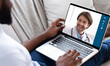 © Prostock-studio - Online Medical Consultancy. Unrecognizable Black Man Having Video Call With His Doctor, Using Laptop At Home, Over Shoulder View